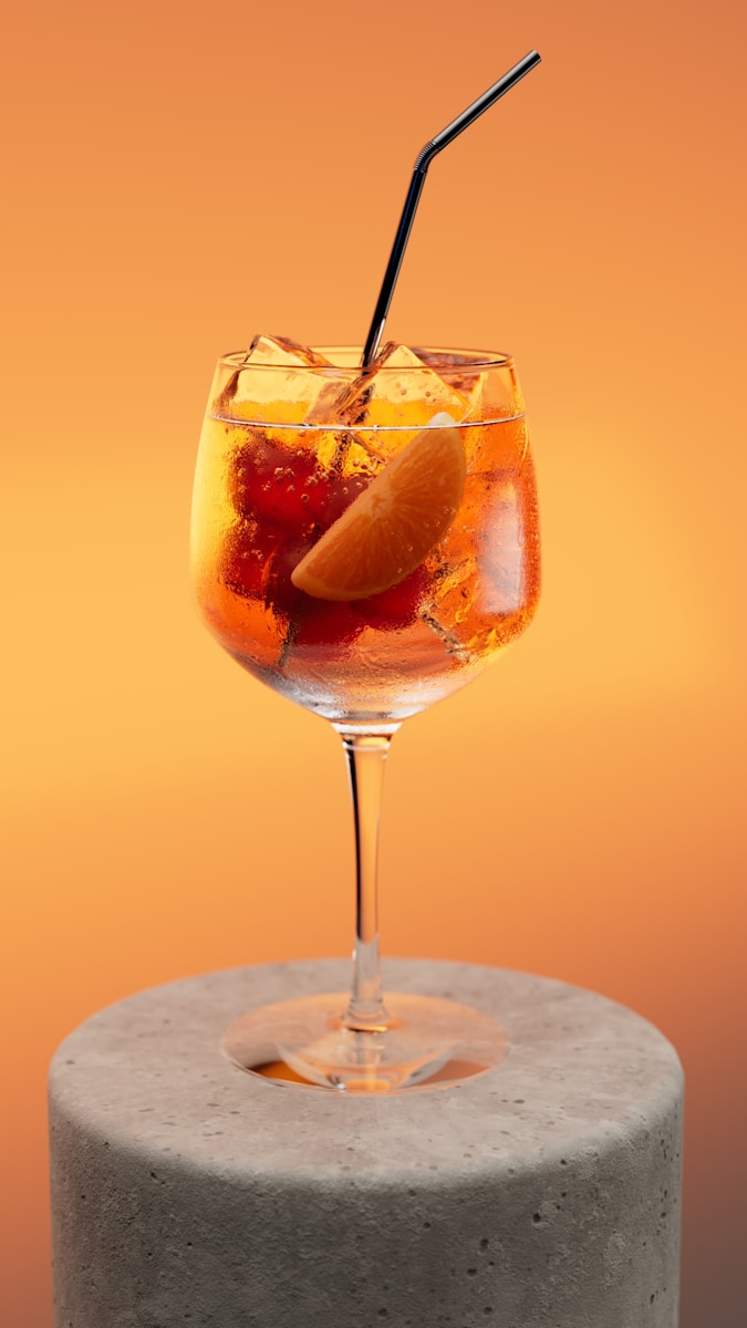 A refreshing cocktail with fruit and ice.