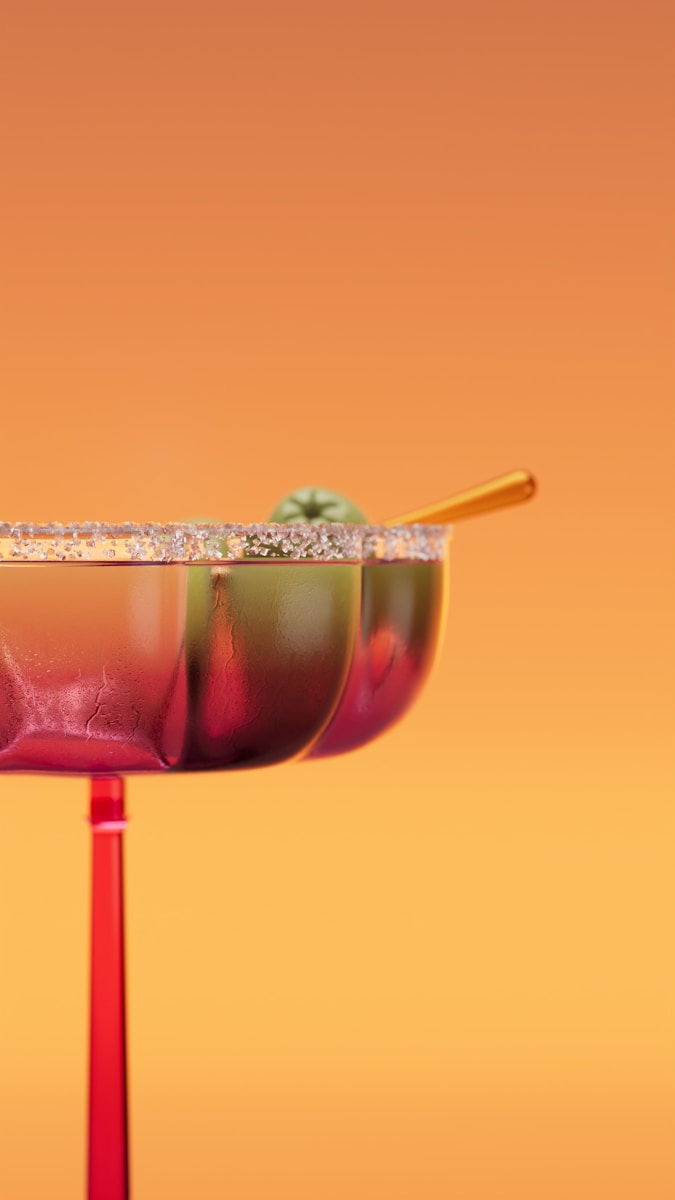 A festive cocktail with a green apple garnish